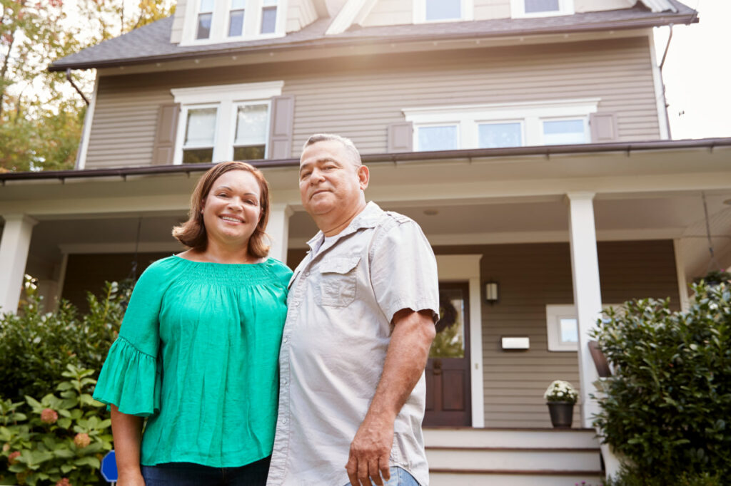 Happy older couple who’ve followed online apartment hunting tips with a virtual apartment tour checklist.