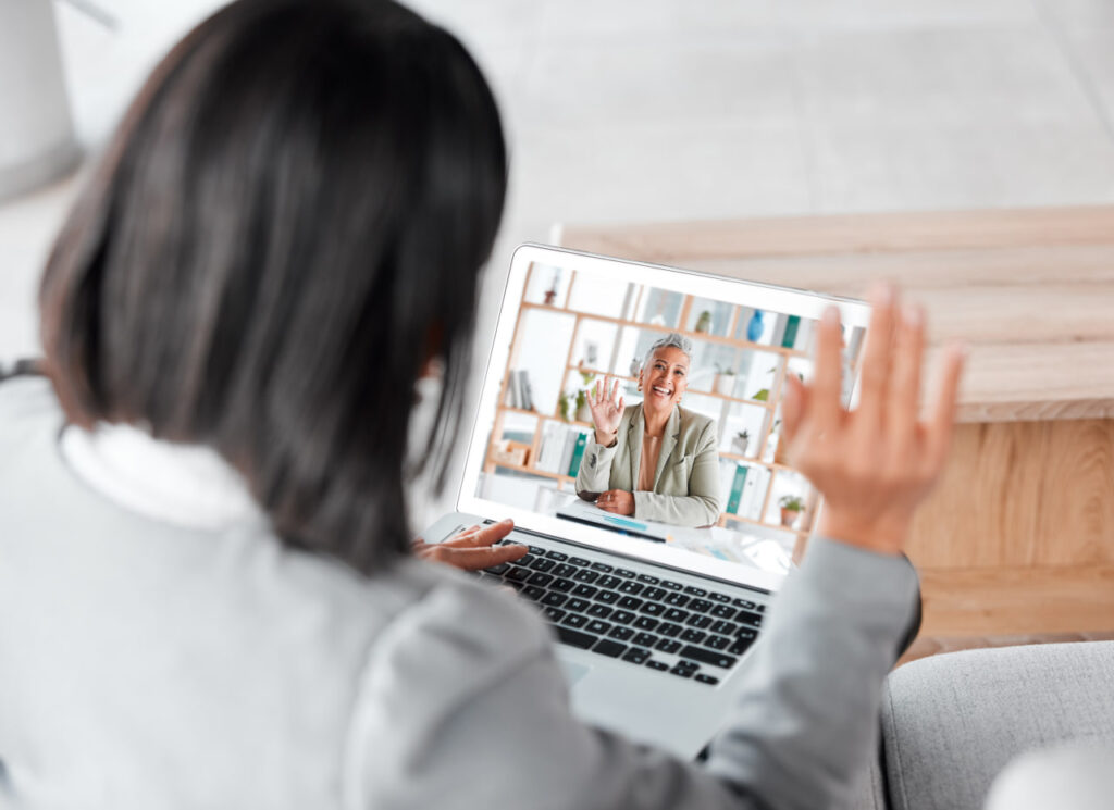Woman talking with a remote realtor to vet rental home remotely.