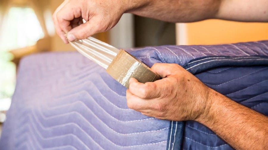 Image 3: Texas movers packing belongings with care.