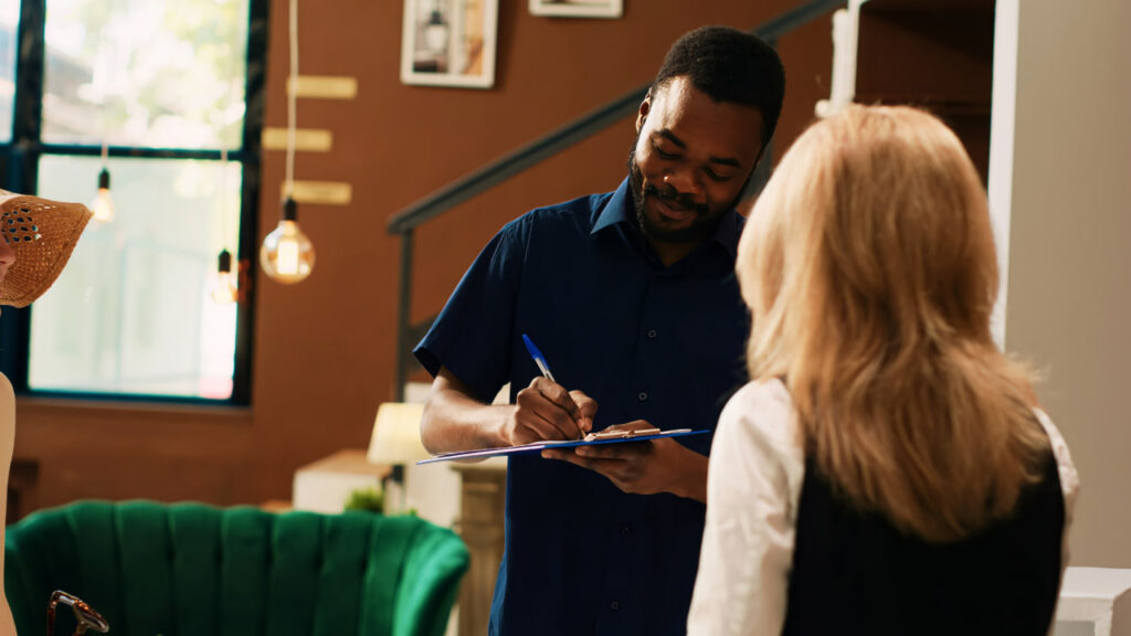 White glove service movers talking with a woman about buying back time during a move.